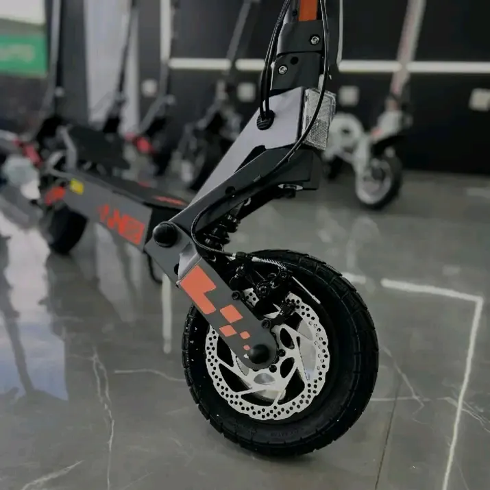 Xiaomi Electric Scooter — Black & Orange (side view)