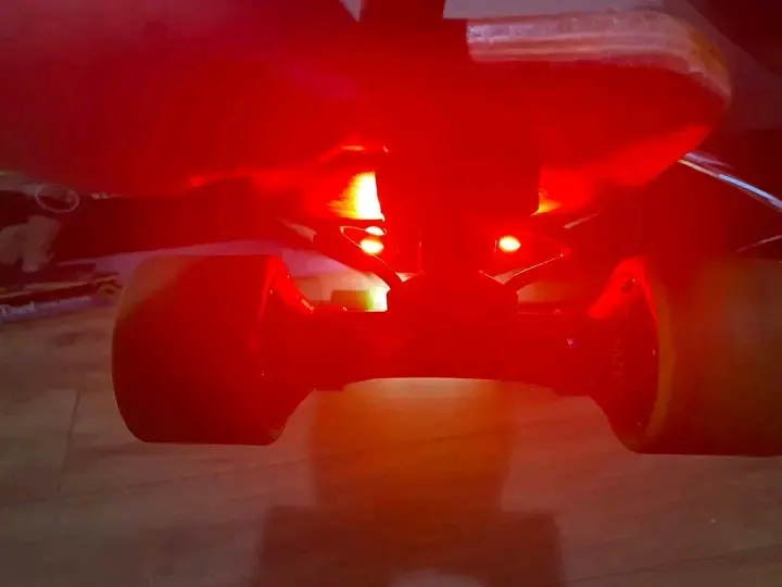 Electric Skateboard — Black & Gold (lights on)